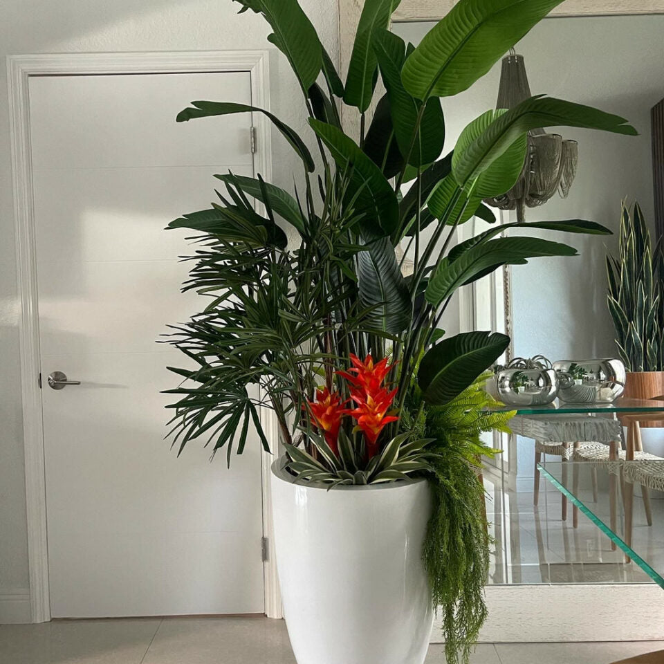 Tropical Luxe Arrangement with Bird of Paradise, Palm Foliage & Bromeliads in Gloss White Vase